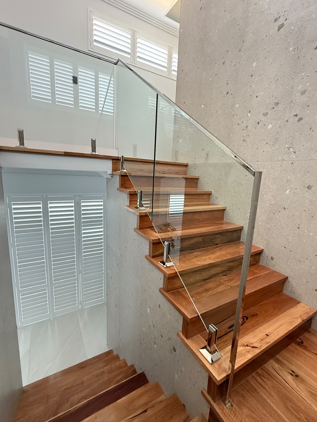 Frameless glass balustrade on a timber staircase