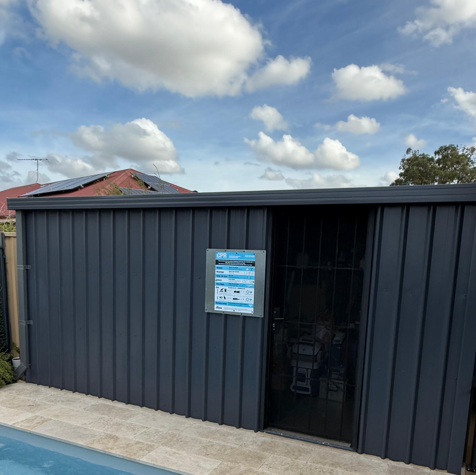 Colorbond garden shed beside a pool